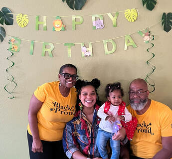 Photo of Tonya Cross visionary of Accented Glory husband, daughter, and granddaughter at her granddaughter's first birthday party! 
